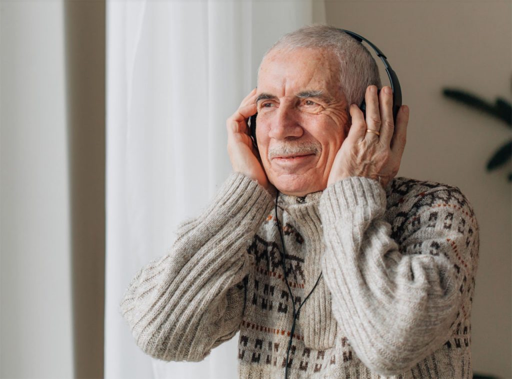 old man with headphone